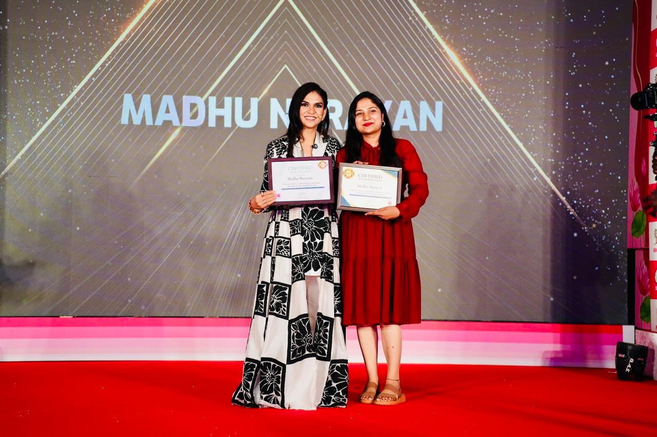 Madhu receiving her certification